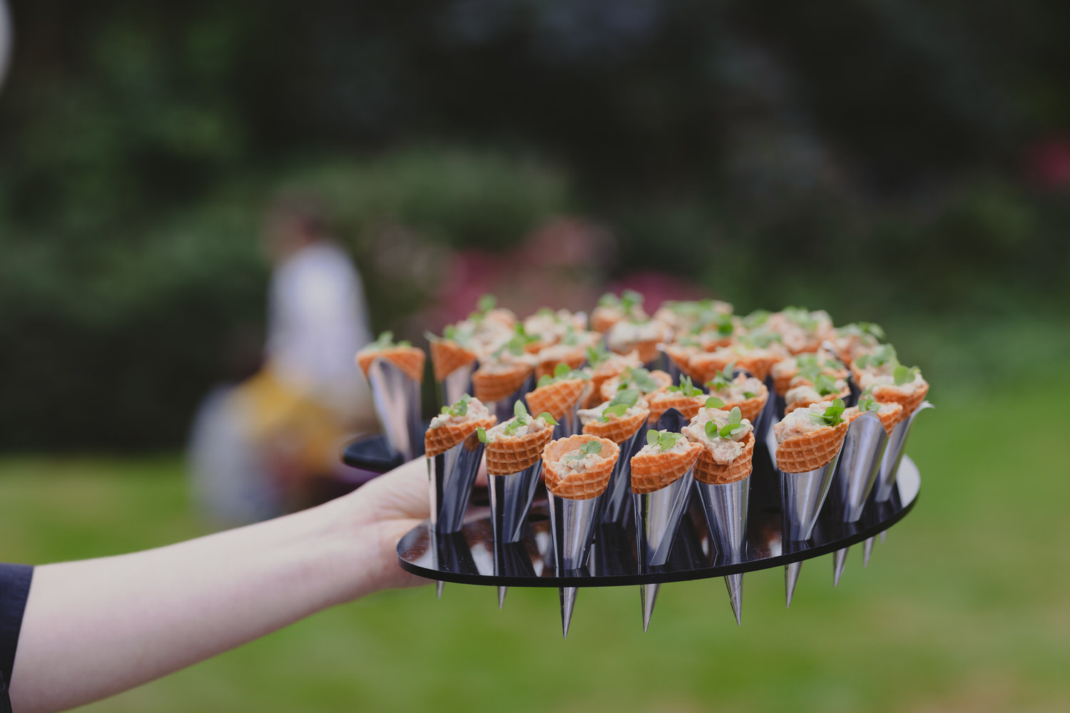 Posh food being held on a acrylic tray